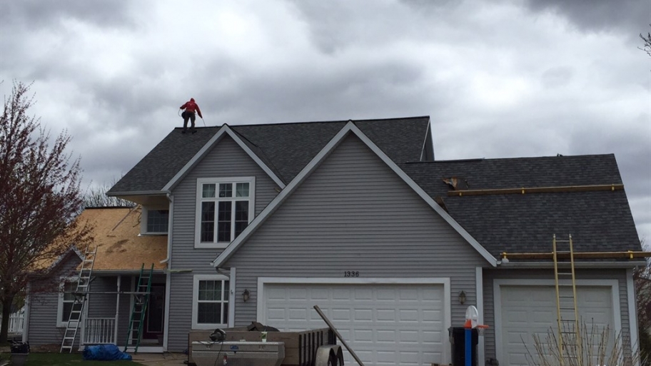 roofers working on asphalt shingle roof